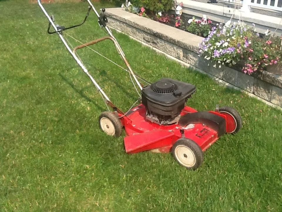 A red push mower back in working order, by Chapman Mills Small Engine Repairs
